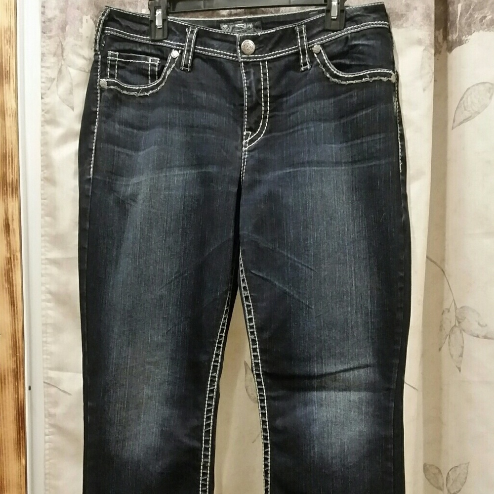 Dark wash boot cut jeans.